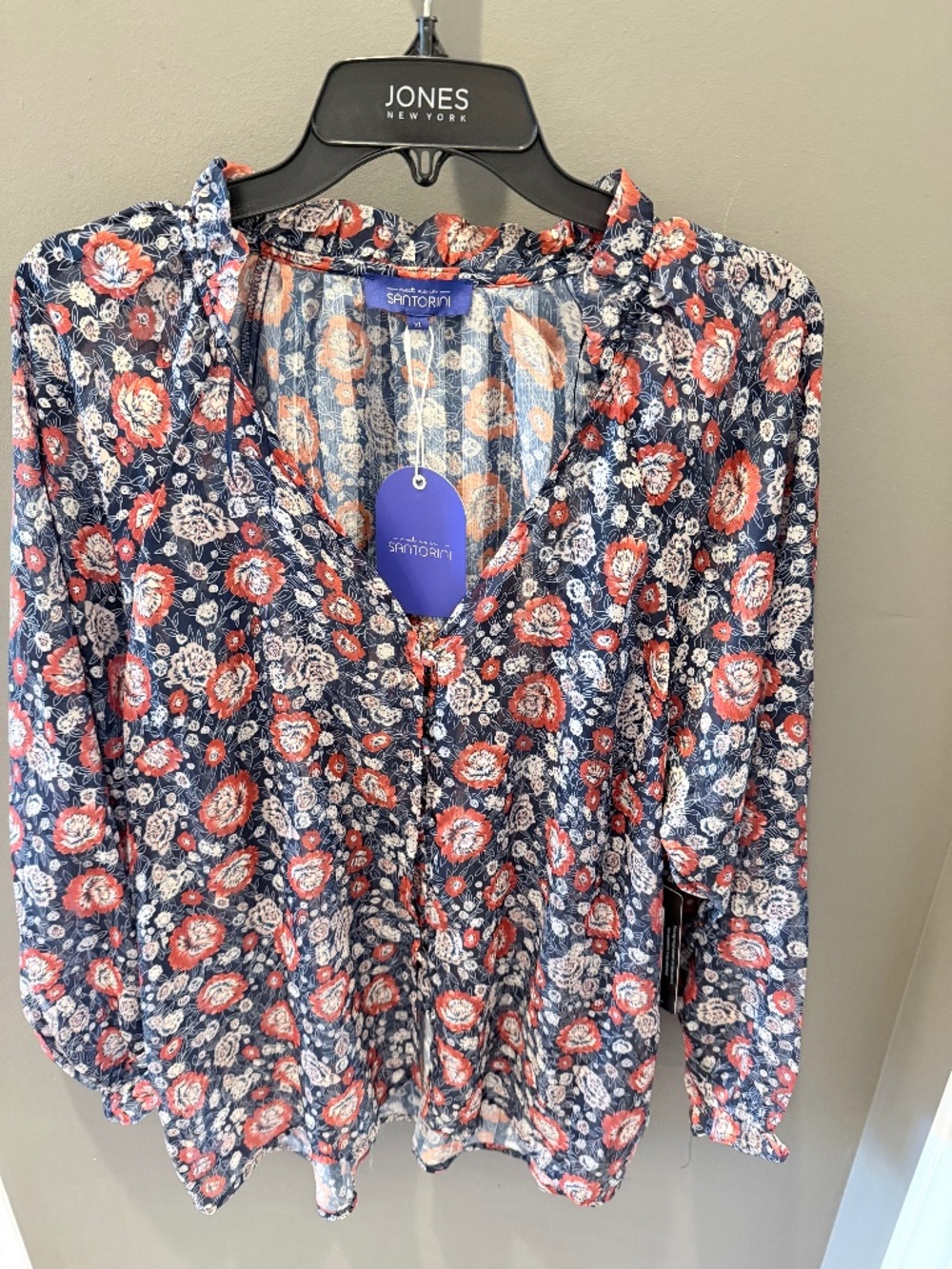 Sheer, long sleeve floral blouse in size XL.